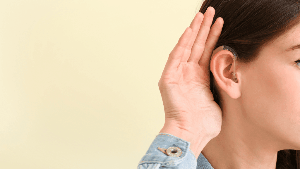 audiologist conducting hearing evaluation